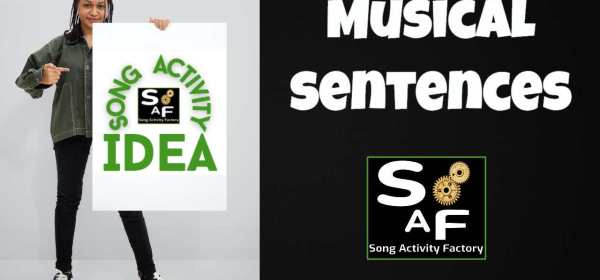 Woman holding a 'Song Activity Idea' poster for ESL Musical Sentences activity