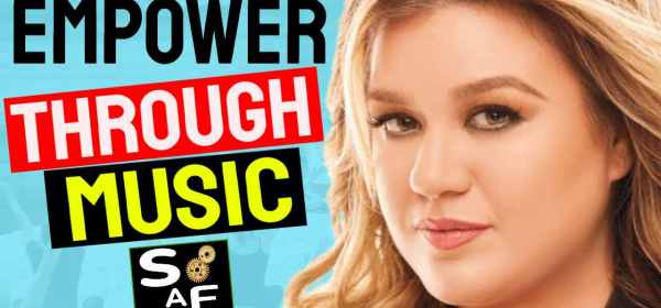 Kelly Clarkson's close-up image with the text "Empower Through Music."